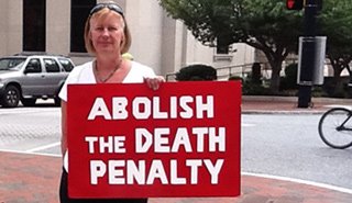 KM-w.-death-penalty-sign.jpg