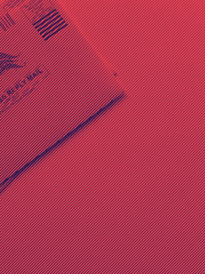 Vote by mail ballot on red and blue background