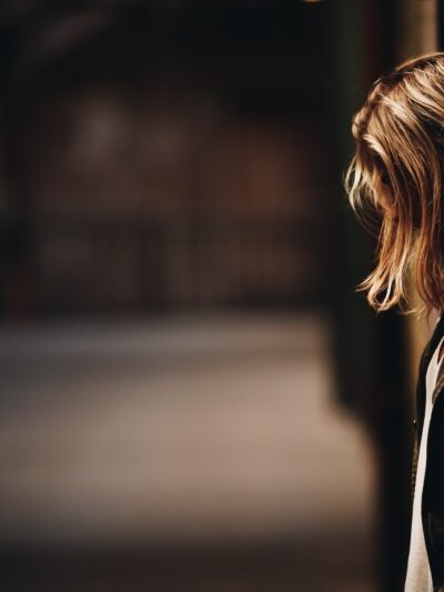 Person standing against wall