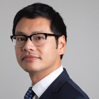 Dale Ho's portrait as he stands angled to his right.