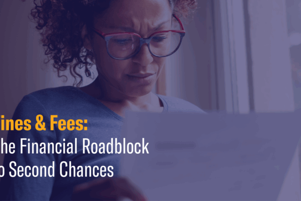 Person looking at piece of paper with concern. Text that reads "Fines & Fees: The Financial Roadblock to Second Chances."