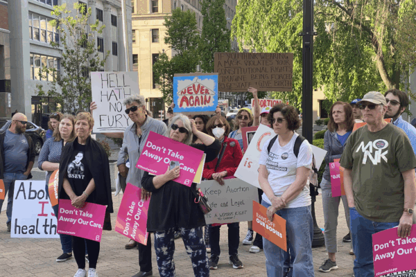 People holding signs at abortion rights rally in Wilmington