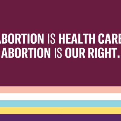 Abortion is health care. Abortion is our right. Trans and non-binary pride flag colors striped below text.