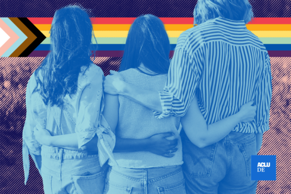 people with their arms around one another and a progress flag in the background