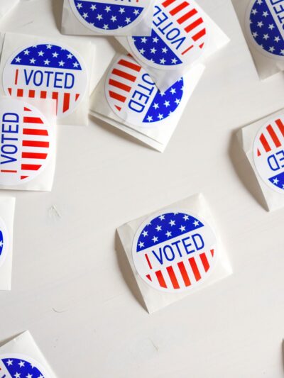 Image of "I Voted" stickers scattered across a table