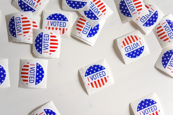 Image of "I Voted" stickers scattered across a table