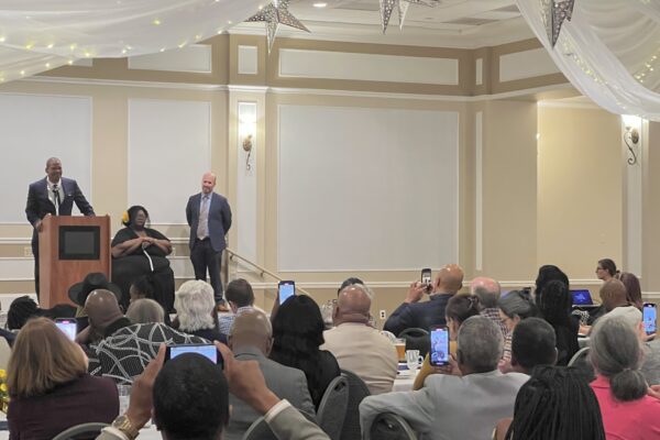 Core Priest accepts his Kandler Award in a room full of guests at Hockessin Memorial Hall during the 2022 Kandler Awards Celebration.