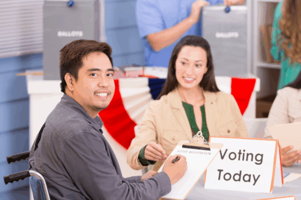 Individual using a wheelchair at a polling location
