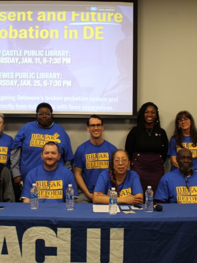 Posed group photo of ACLU-DE staff, Senator Marie Pinkney, and Smart Justice Ambassadors