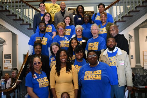 ACLU-DE staff and advocates pose on the stairs of Legislative Hall with Sen. Marie Pinkney