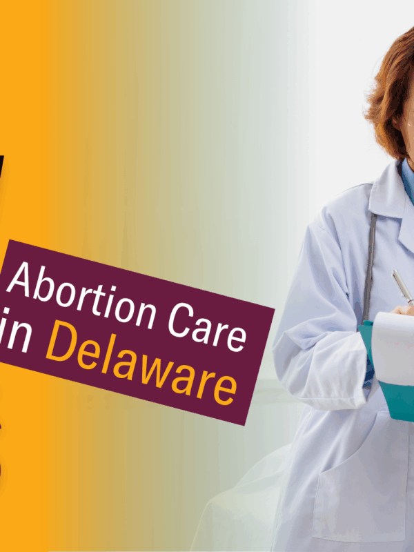 A doctor with a patient both looking at a clipboard