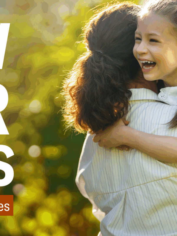 Text: Know Your Rights: Immigrant Students and Families. Image: A woman with a curly ponytail facing away from the camera holding a young girl with a backpack who is laughing