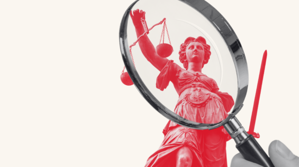 Lady justice under a magnifying gladd