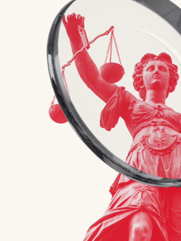 Lady justice under a magnifying gladd
