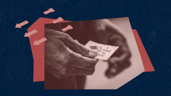 Image of hands holding an "I voted" sticker against a blue background