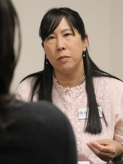 candid photo of Gloria Ho speaking with someone at HB94 lobby day