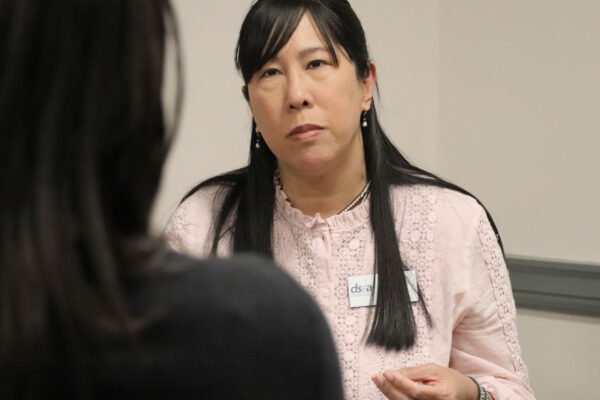 candid photo of Gloria Ho speaking with someone at HB94 lobby day