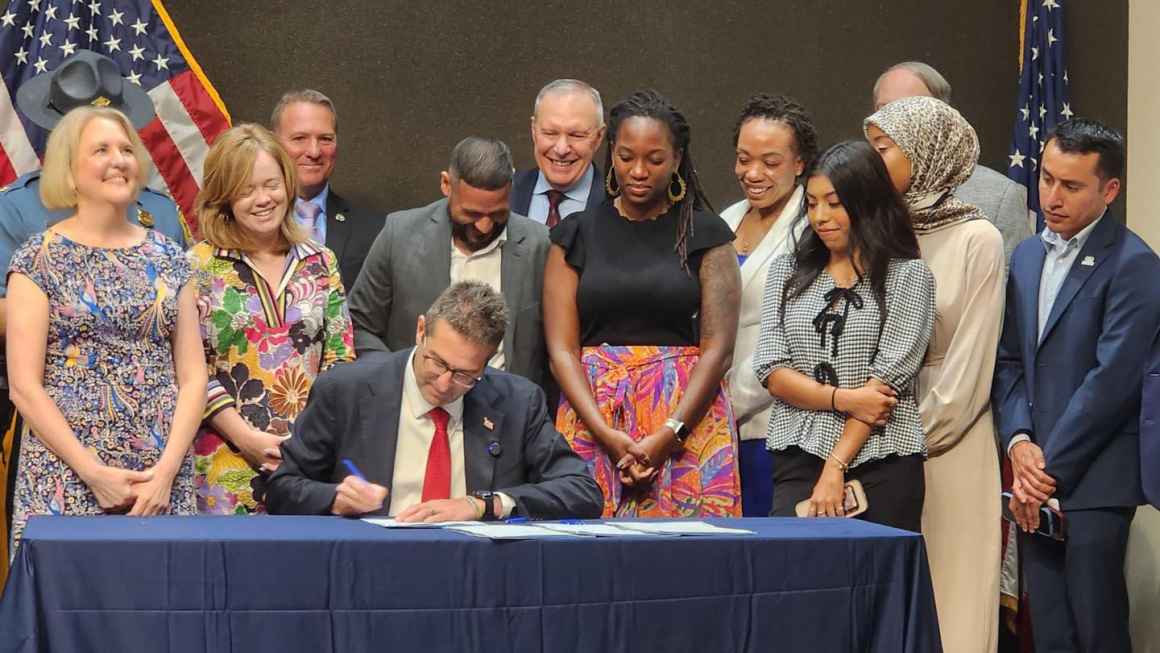 Photo provided by La ZMX Delaware. Gov Meyer signing House Bill 182
