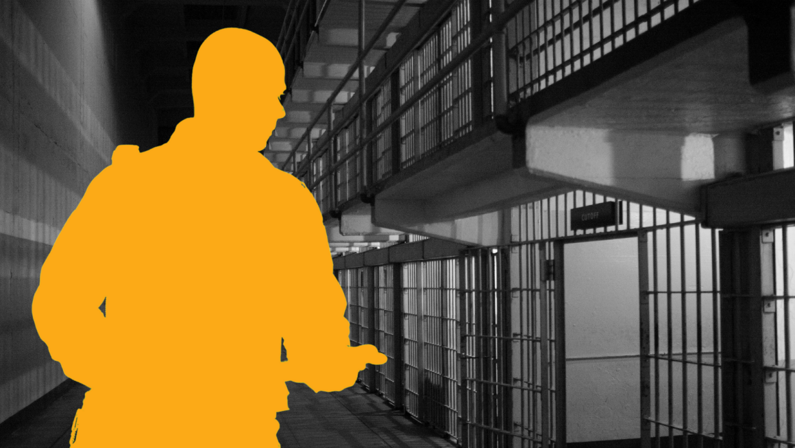 Silhouette of guard standing in front of jail cell