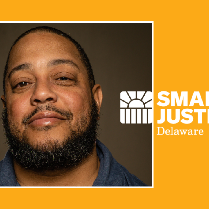 Headshot of Daron "Timeless Thomas" Swann with Smart Justice Delaware logo