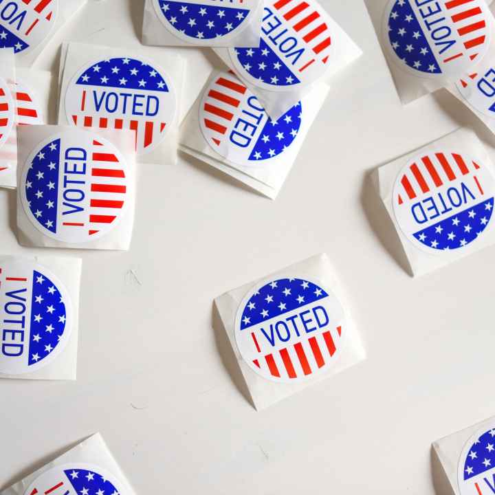 Image of "I Voted" stickers scattered across a table