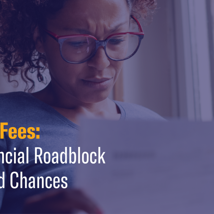 Person looking at piece of paper with concern. Text that reads "Fines & Fees: The Financial Roadblock to Second Chances."