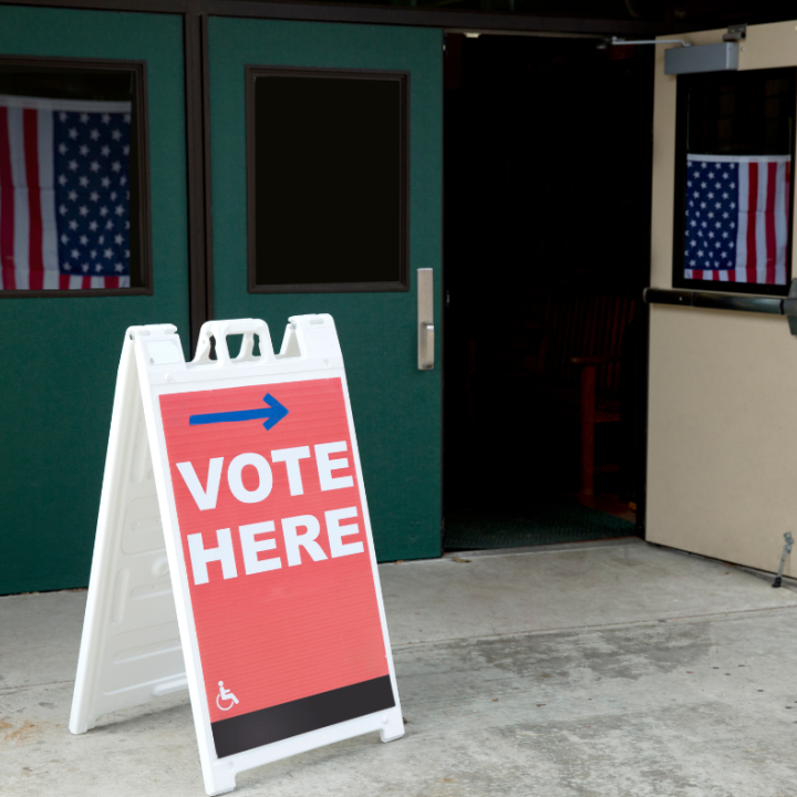 Vote here sign